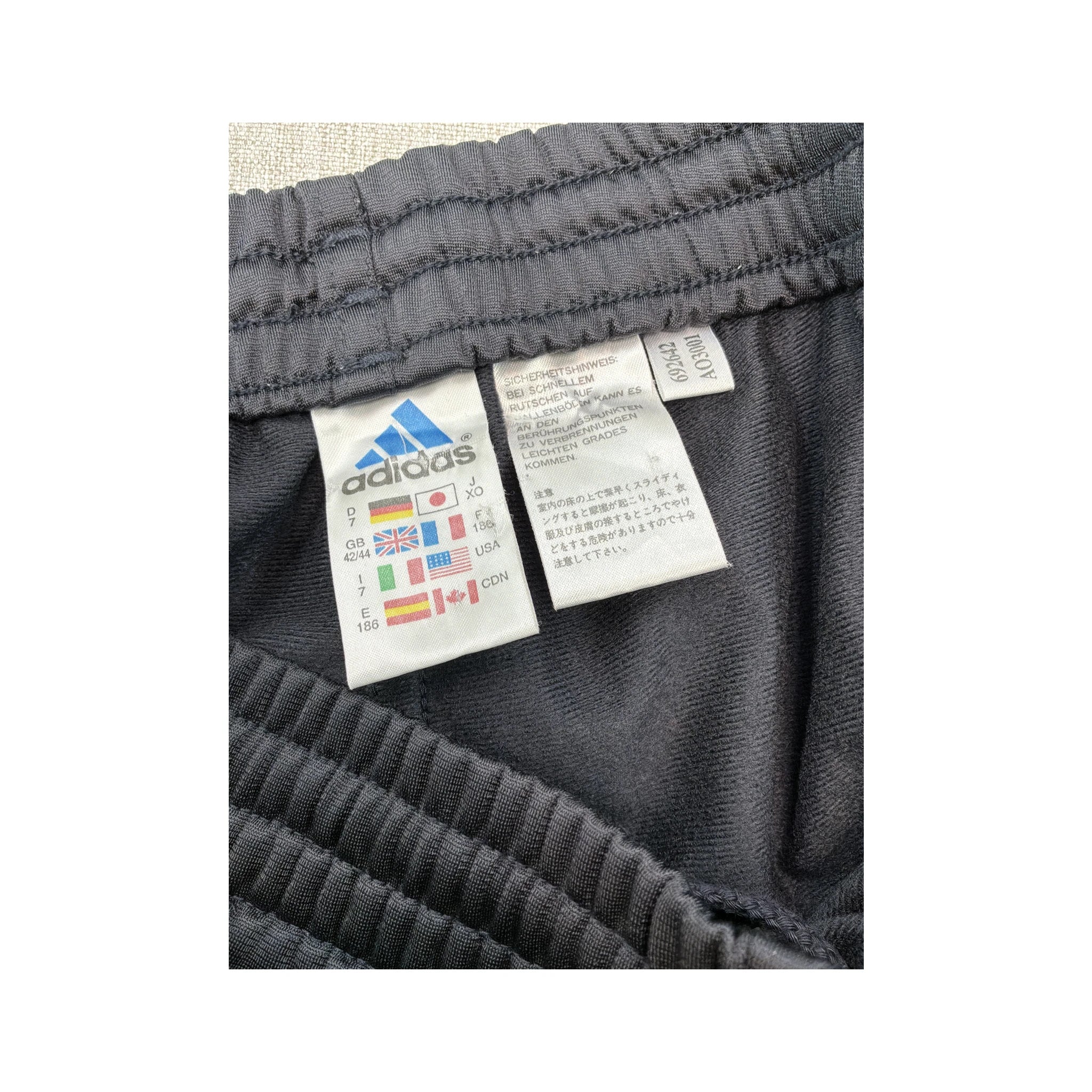 Calças de fato de treino adidas com Três riscas