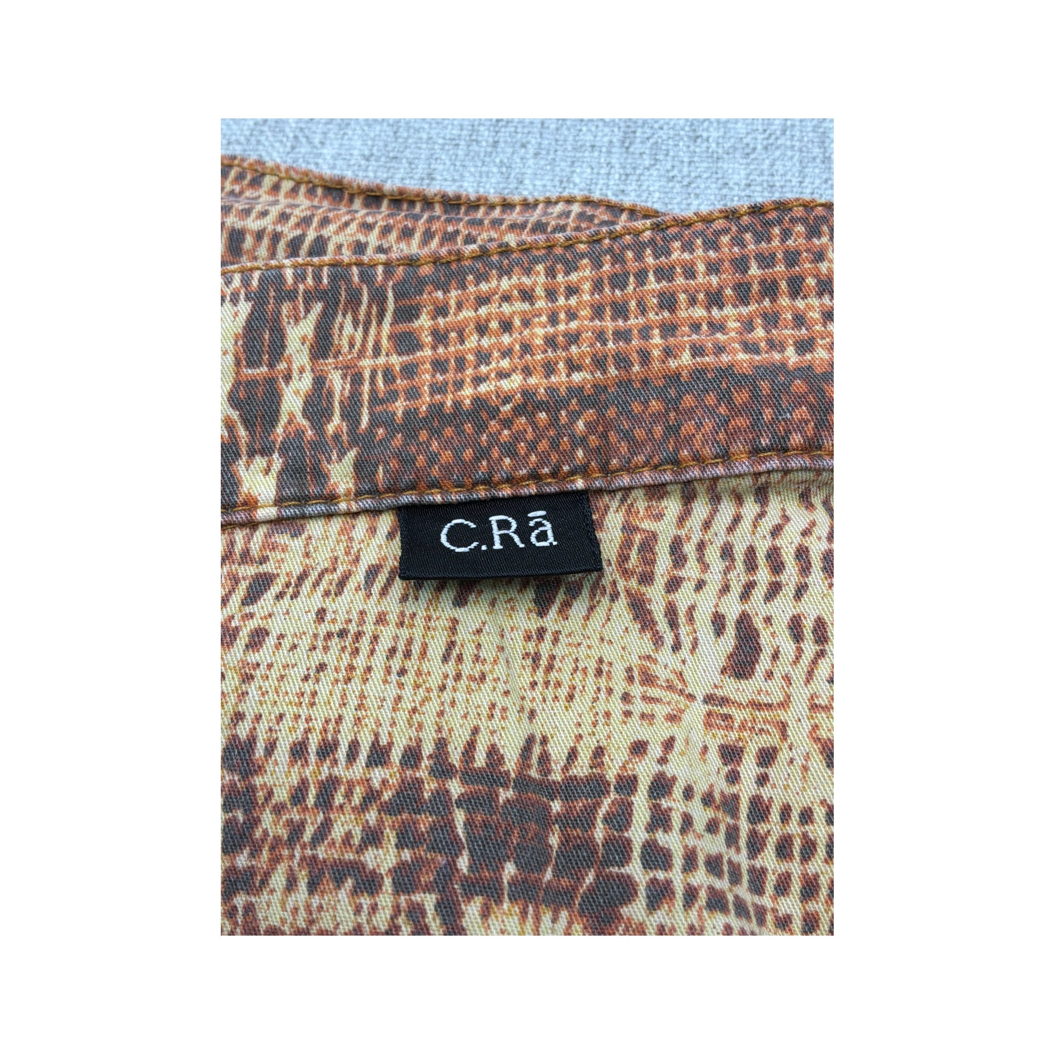 C.Ria Abstract Print Ruffle Hem Cropped Pants