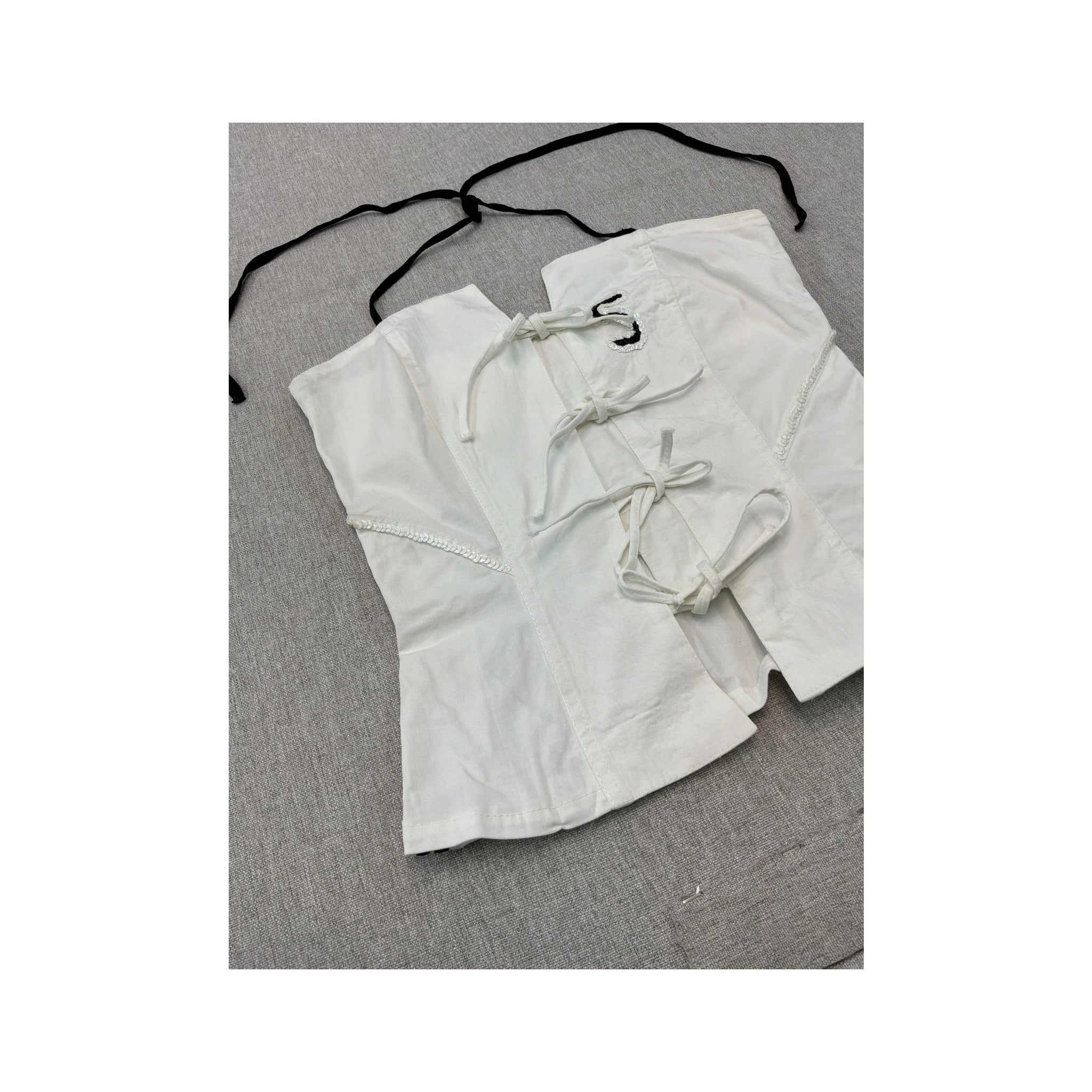 White Corset Top with Black Striped Trim and Lace-Up Detail