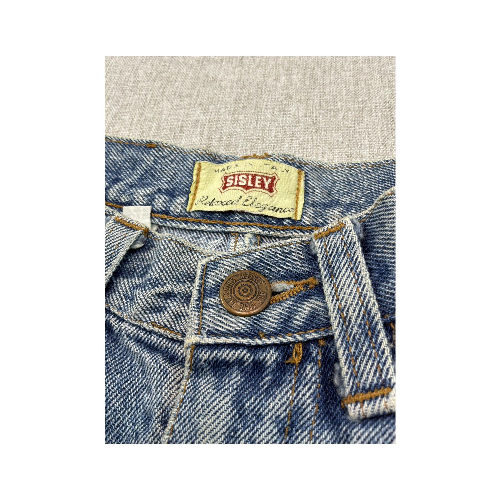 Mini saia Sisley vintage em ganga de Lavagem Clara